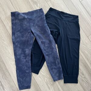 Womens Lululemon size 12 pants. One blue tie dye legging and one navy jogger